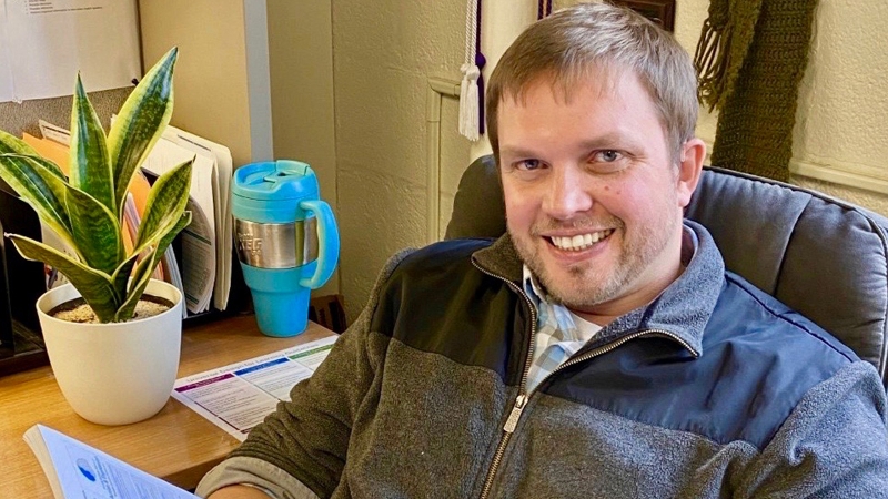 Photo of author Eric Moore in this office.