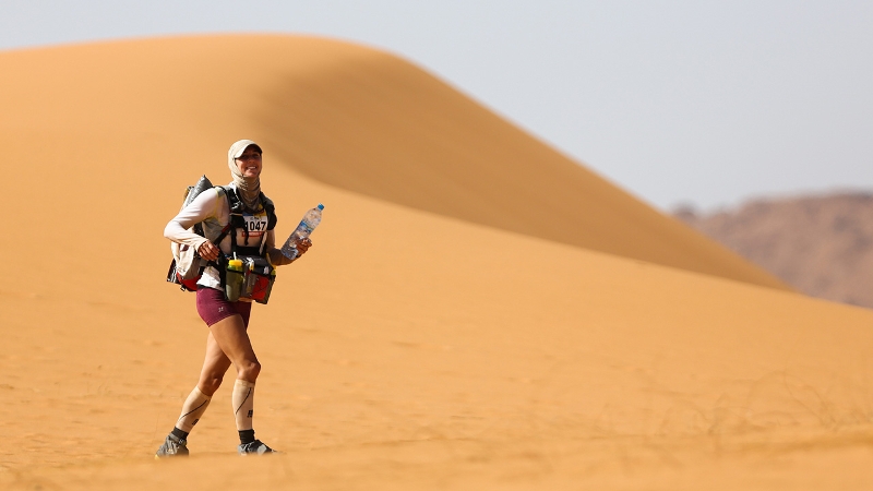Liz Bryon trekking through the desert