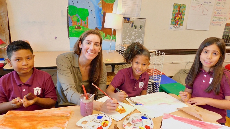 Liz Byron painting with her art students