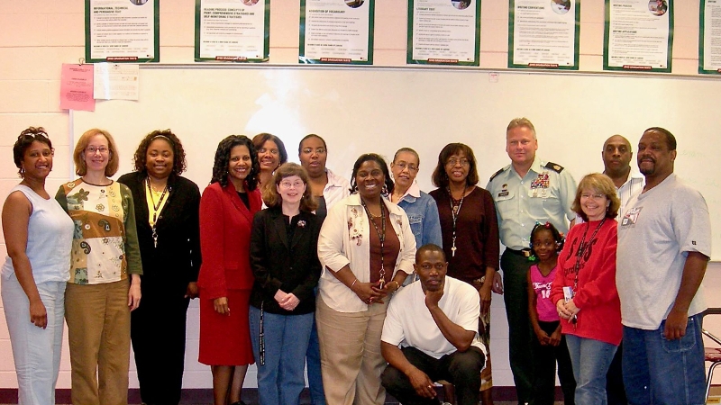 A group photo of Andratesha Fritzgerald and colleagues